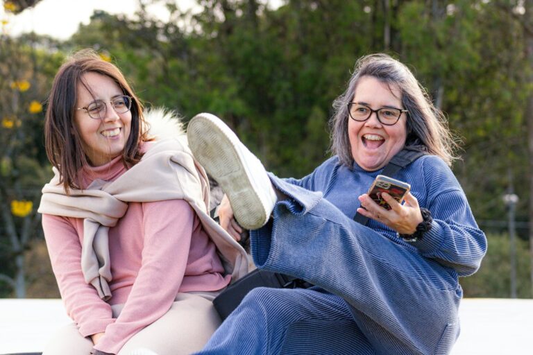 older women laughing together outdoors — photo by Samuell Morgenstern on Unsplash